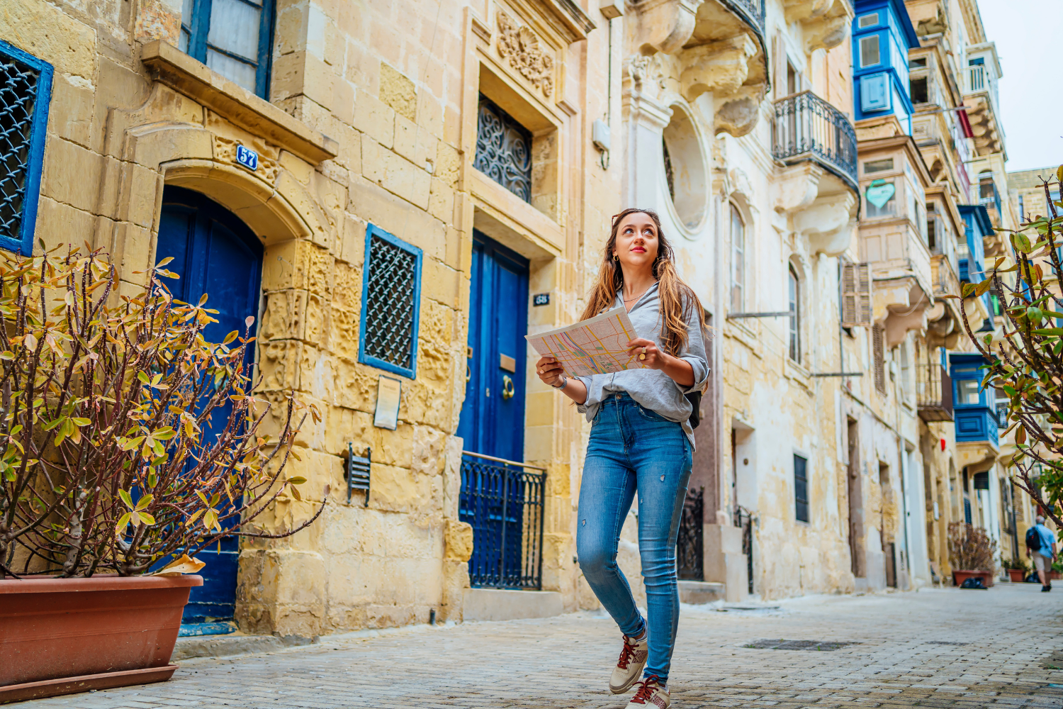 Young Female tourist Visiting La Valletta in Spring using a map